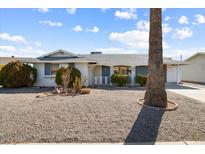 Charming single-story home featuring desert landscaping, a covered porch, and a well-maintained exterior at 10423 W Monterosa Dr, Sun City, AZ 85351