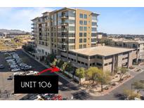 Beautiful multi-story condo with a parking area with unit 106 identified via directional arrow at 15215 N Kierland Blvd # 106, Scottsdale, AZ 85254