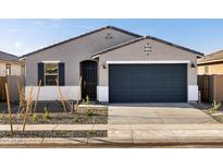 Charming single-story home featuring a gray stucco exterior, dark blue garage door and desert landscaping at 15993 W Cottontail Ln, Surprise, AZ 85387