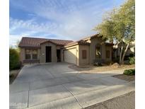 Charming single-story home with desert landscaping, concrete driveway, and inviting curb appeal at 18391 W Stinson Dr, Surprise, AZ 85374