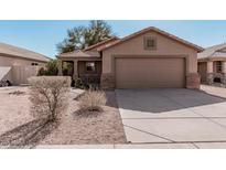 Charming single-story home with a well-maintained front yard and a two-car garage at 1903 E San Tan St, Chandler, AZ 85225