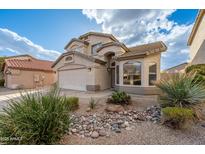 Two-story home with a front yard featuring desert landscaping and an attached two-car garage at 20914 N 39Th Way, Phoenix, AZ 85050