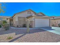 Inviting single-story home with low-maintenance desert landscaping and attached two car garage at 21511 N 79Th Dr, Peoria, AZ 85382