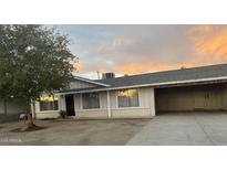 Cozy single story home with attached carport and beautiful sunset view at 3042 N 87Th Ave, Phoenix, AZ 85037