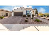 Charming single-story home with a well-maintained front yard and a two-car garage at 5624 S Winchester --, Mesa, AZ 85212