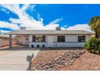 Charming single-story home featuring a covered carport and low-maintenance desert landscaping at 1117 W Mesquite St, Chandler, AZ 85224