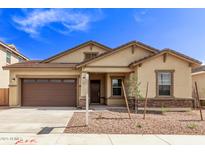 Inviting single-story home showcasing a well-manicured lawn and charming architectural details at 20931 E Via Del Sol St, Queen Creek, AZ 85142