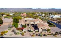 Stunning single-story home with a desert landscape and Spanish tile roof in a beautiful golf course community at 27701 N Lucero Dr, Rio Verde, AZ 85263