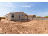 Spacious backyard featuring dirt landscaping and block wall, offering privacy and potential for customization at 4821 S 12Th St, Phoenix, AZ 85040