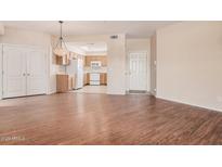 Spacious living room area with an open layout to the kitchen at 9151 W Greenway Rd # 277, Peoria, AZ 85381