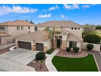 Stunning two-story home featuring a three-car garage and beautifully landscaped front yard at 9765 E Lompoc Ave, Mesa, AZ 85209