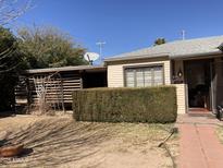 Charming single-story home featuring a well-kept front yard and classic architectural details at 110 E 8Th St, Casa Grande, AZ 85122