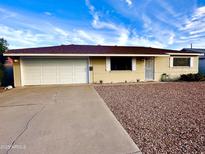 Charming single-story home with a two car garage, brick exterior and low maintenance landscaping at 3328 W Charter Oak Rd, Phoenix, AZ 85029