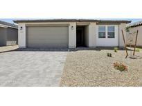 Charming single-story home featuring a neutral color palette, desert landscaping, and a spacious two-car garage at 4513 W 95Th Dr, Tolleson, AZ 85353