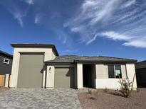 Charming single-story home with a two-car garage and beautiful desert landscaping at 7654 W Tether Trl, Peoria, AZ 85383