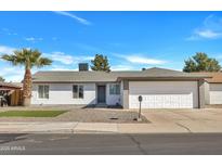 Charming single-story home with well-maintained landscaping and a two-car garage at 10013 N 56Th Dr, Glendale, AZ 85302