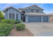 Beautiful two-story home featuring a spacious three-car garage and well-manicured front yard at 1260 N Concord Ave, Chandler, AZ 85225