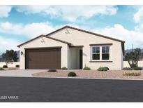 Charming single-story home with neutral stucco, a brown garage door, and low-maintenance desert landscaping at 15705 W Beryl Ave, Waddell, AZ 85355