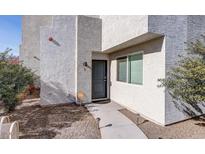 A close up of the exterior of the townhome highlighting the front door and walkway at 2820 E Tracy Ln # 1, Phoenix, AZ 85032