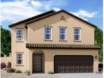 Charming two-story home features a neutral stucco facade, tile roof and attached two-car garage at 5828 W Willow Ridge Dr, Laveen, AZ 85339