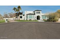 Stunning two story home with a circular drive and well manicured yard at 11745 N 99Th St, Scottsdale, AZ 85260