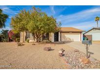 Charming single story home with mature shade tree and low maintenance desert landscaping at 17420 N 36Th Ave, Glendale, AZ 85308