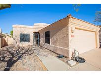 Single-story home featuring a two car garage, a low maintenance yard, and desert landscaping at 12224 N Gambel Dr, Fountain Hills, AZ 85268
