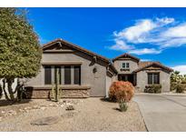 Charming single-story home with desert landscaping and neutral color palette at 30789 N Raindance Rd, San Tan Valley, AZ 85143