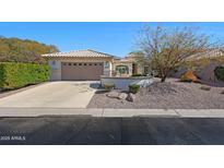 Charming home featuring a well-manicured front yard, neutral tones and a two car garage at 3777 N 162Nd Ave, Goodyear, AZ 85395