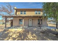 Charming two-story home with a covered porch and stucco exterior at 4302 W Dobbins Rd, Laveen, AZ 85339