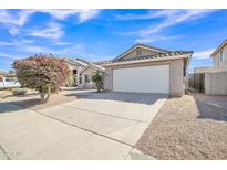Charming single-story home featuring a two-car garage, landscaped front yard, and desert-friendly landscaping at 9609 E Monte Ave, Mesa, AZ 85209