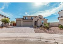 Charming two-story home featuring a three-car garage, desert landscaping and a paver driveway at 1997 E Brooklyn Dr, Casa Grande, AZ 85122