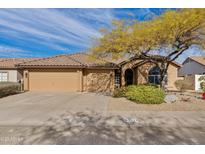 Charming single-story home featuring a well-maintained front yard and a two-car garage at 4514 E Mazatzal Dr, Cave Creek, AZ 85331