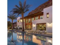 Inviting community pool with sun loungers and a modern, stylish building backdrop for luxurious outdoor living at 5000 N Camelback Ridge Dr # 304, Scottsdale, AZ 85251