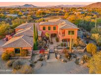 A grand estate with stunning desert landscaping and mountain views at 7500 E Roy Rogers Rd, Scottsdale, AZ 85266