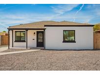 Charming single-story home with a minimalist design and low-maintenance desert landscaping at 2236 N Edgemere St, Phoenix, AZ 85006