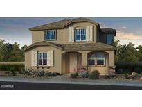 Two-story home featuring stone veneer accents, shuttered windows, and a covered front entryway at 3767 N 99Th Dr, Avondale, AZ 85392