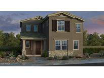 Inviting two-story home with neutral paint, shutters, and a charming front porch at 3821 N 99Th Dr, Avondale, AZ 85392