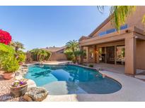 Private backyard pool with mature landscaping and patio area for entertaining or relaxation at 408 E Silverwood Dr, Phoenix, AZ 85048
