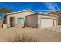 Charming single-story home with a well-maintained front yard and two car garage at 502 E Mountain View Rd, San Tan Valley, AZ 85143