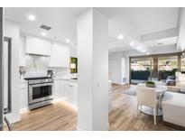 Modern kitchen featuring stainless steel appliances, white cabinetry, and open layout, perfect for cooking and entertaining at 7161 E Rancho Vista Dr # 1011, Scottsdale, AZ 85251