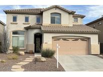 Charming two-story home featuring a neutral color scheme and a well-manicured front yard at 16823 S 27Th Ave, Phoenix, AZ 85045