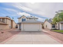 Charming two-story home with a large driveway and well-maintained front yard in a suburban neighborhood at 3829 W Folley St, Chandler, AZ 85226