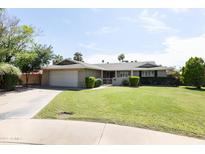 Charming single-story home with a well-manicured lawn and a two-car garage at 3726 S Juniper St, Tempe, AZ 85282