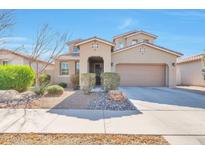 Charming two-story home featuring a neutral exterior, well-manicured landscaping, and an attached two-car garage at 9743 E Torino Ave, Mesa, AZ 85212