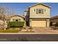 Charming two-story home with a brick driveway and two-car garage at 10136 E Sphere Ave, Mesa, AZ 85212