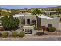 Stunning desert home featuring a charming courtyard, desert landscaping, and a private front entrance with mountain views at 38820 N 10Th St, Phoenix, AZ 85086