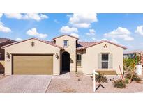 Charming single-story home featuring a brown garage door, arched entryway, and low-maintenance front yard at 8804 W Vista Ave, Glendale, AZ 85305