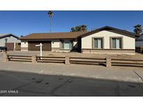 Charming single-story home featuring a two-car garage and a well-maintained front yard at 10633 N 46Th Ave, Glendale, AZ 85304