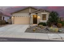Charming single-story home featuring desert landscaping, a two-car garage, and covered porch entry at 11674 E Yeager Cyn, Gold Canyon, AZ 85118